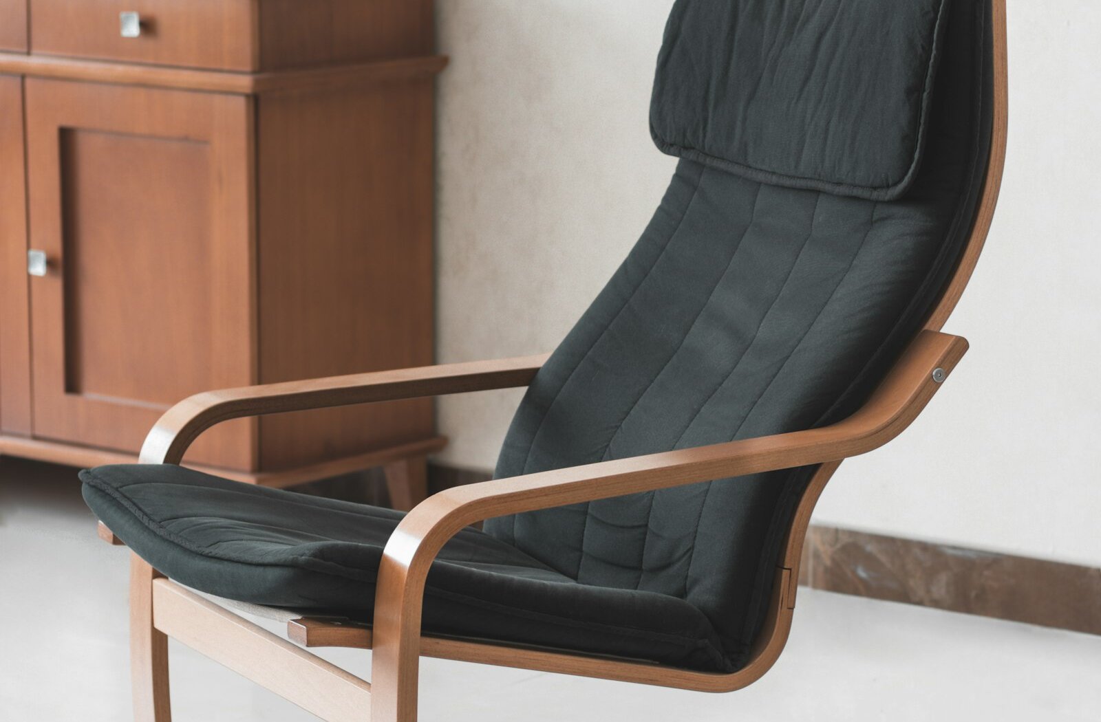 An armchair in a neatly arranged living room