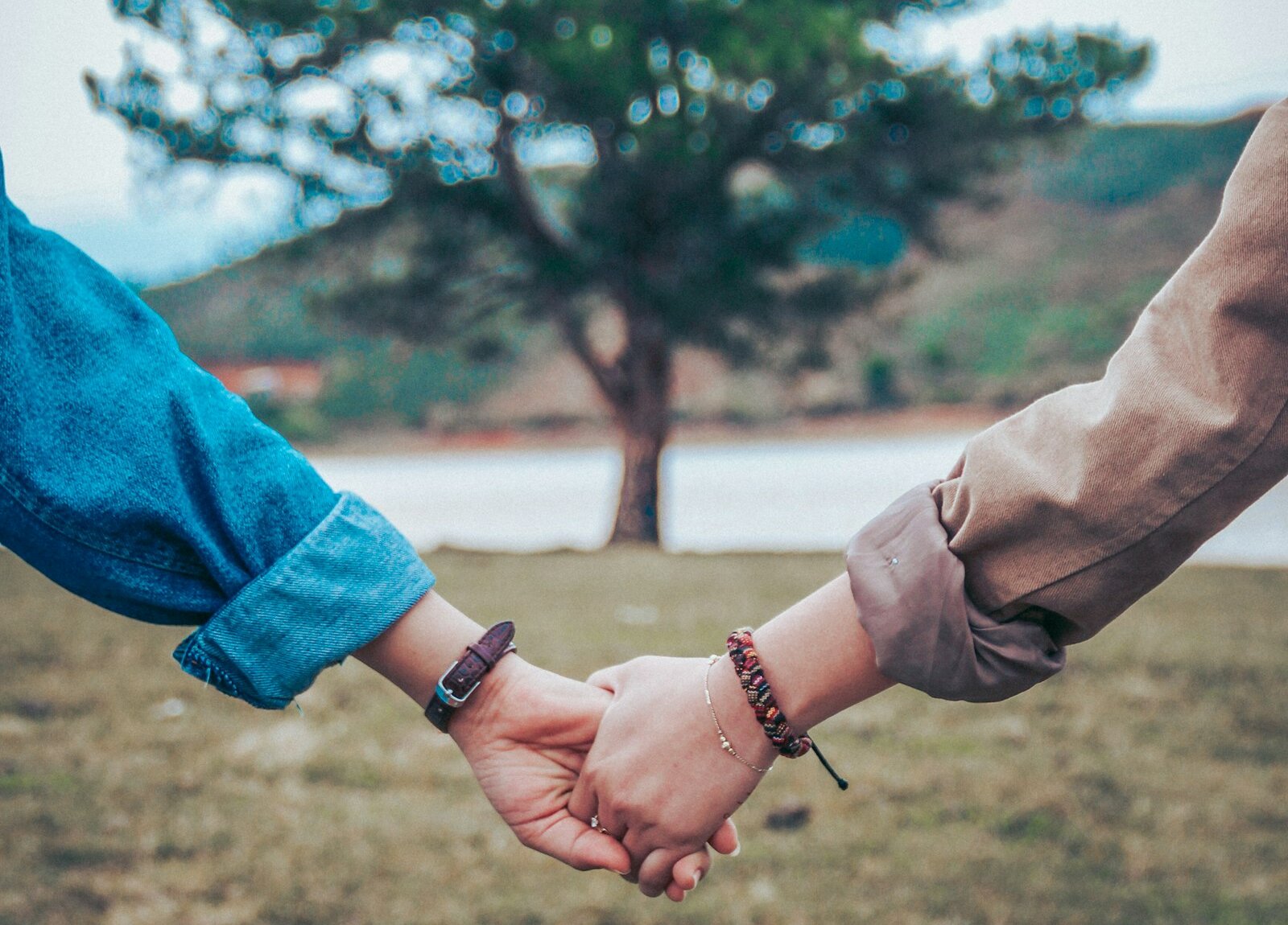 Two people holding hands