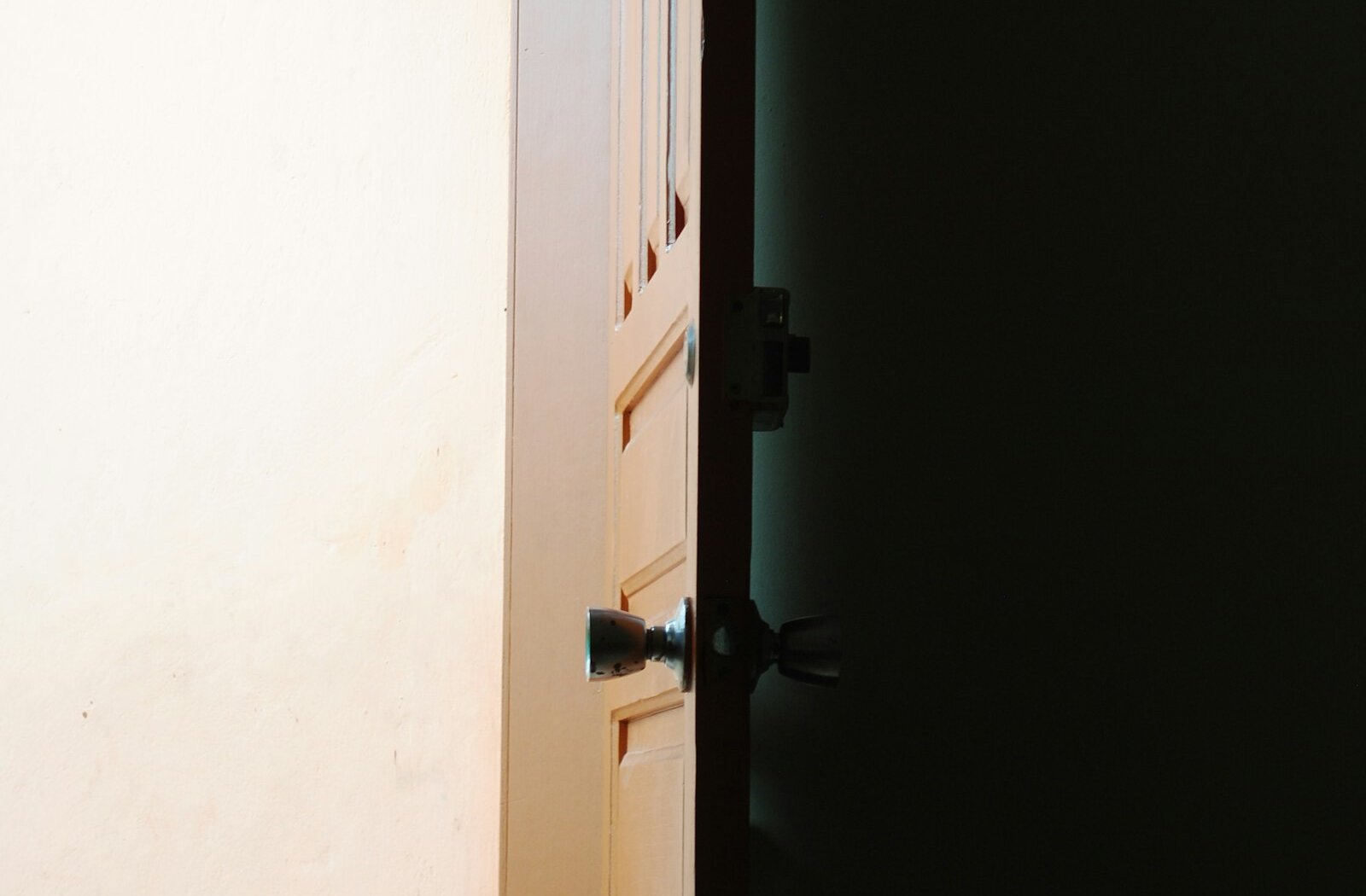A wall lamp casting soft light on a plain wall